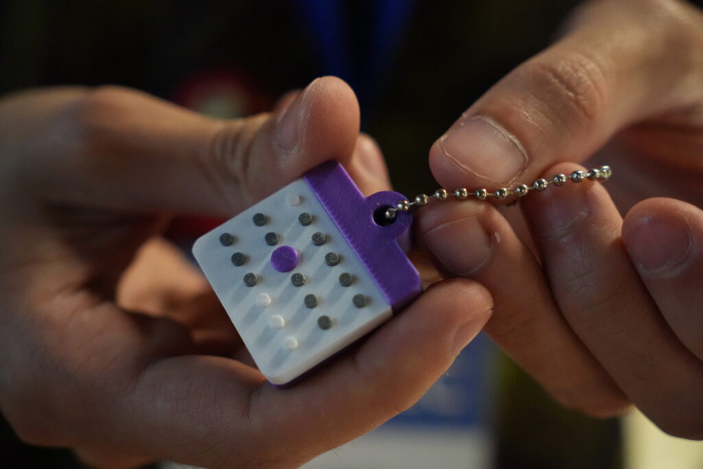 A hand holding a 3D printed calendar